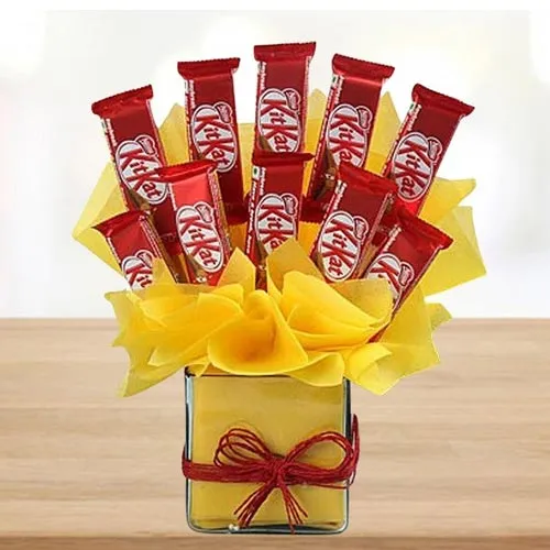 Enticing Arrangement of Kitkat Chocolates in Glass Vase
