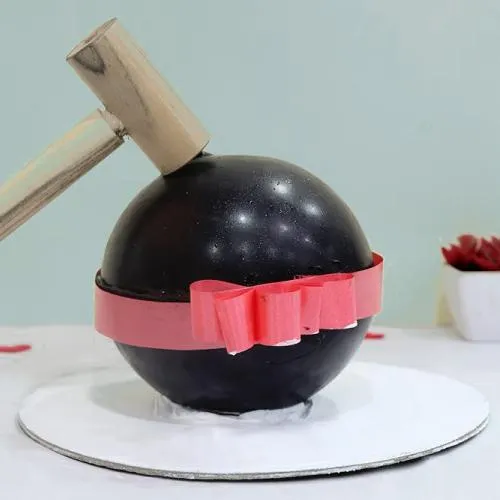 Mouth-Watering Chocolate Ball Piata Cake with Hammer