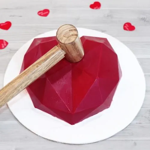 Delicious Red Heart Shape Piata Cake with Hammer