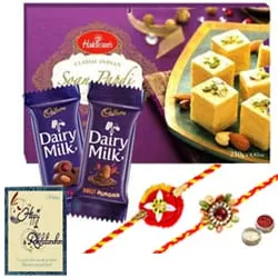 Exquisite Festive Favorite Sweets N Chocolate Gift Hamper with Two Rakhis With Free Rakhi Card and Roli Tilak Chawal