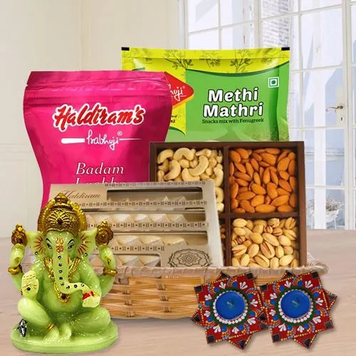 Exciting Diwali Gift Hamper of Dry Fruits, Haldriam Sweets, Ganesh Idol  N  Dot Mandala Art Diya