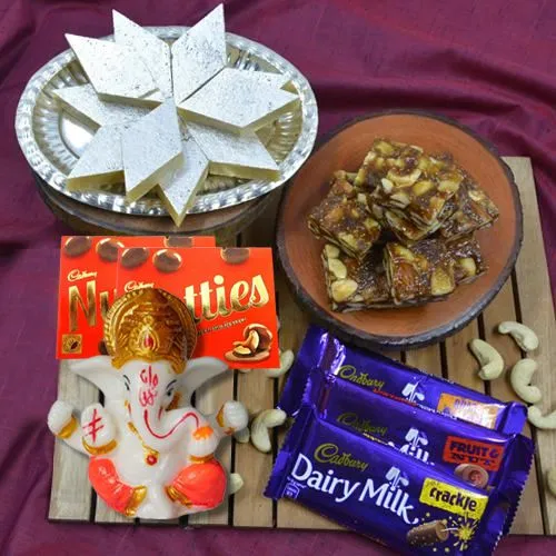Classy Combo of Marble Ganesha with Cadbury Chocolates n Haldiram Sweets