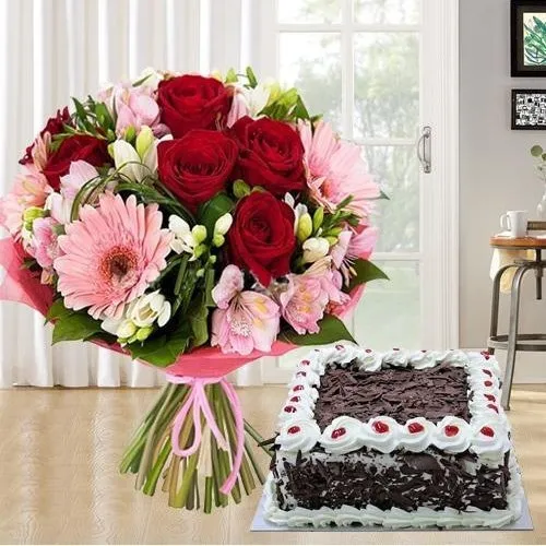 Mixed fresh Seasonal Flowers with festive Black Forest Cake