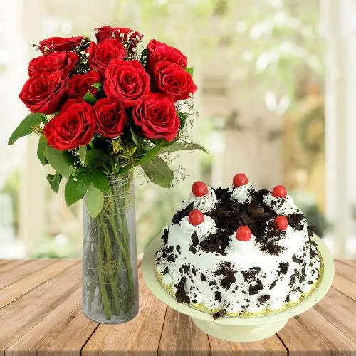 Exclusive Vase display of 12 Red Roses n Black Forest Cake