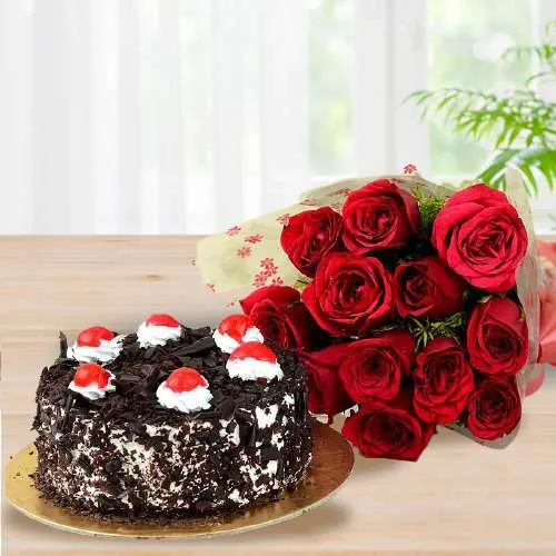 Exciting Combo of Red Dutch Roses Arrangement n Black Forest Cake