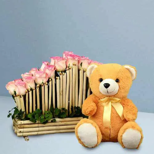 Graceful Pink Roses Cupid Shape Basket with a Brown Teddy