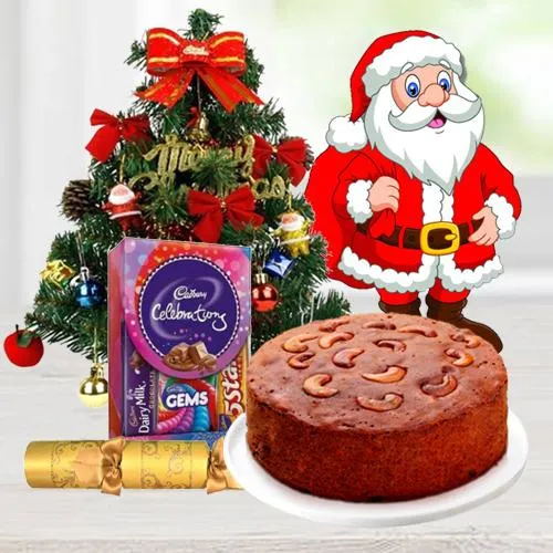Christmas Fruit Cake 1 Lbs. with Christmas Tree 1 Ft. long artificial, Assorted Cadbury�s Chocolates for hanging ( 130 G.), Star and Bells for decoration, Santa Claus and  Handheld Ribbon Crackers for Christmas