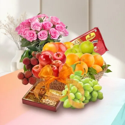 Elegance of Fresh Fruits Basket with Tasty Haldiram Soan papdi and Rose Bouquet