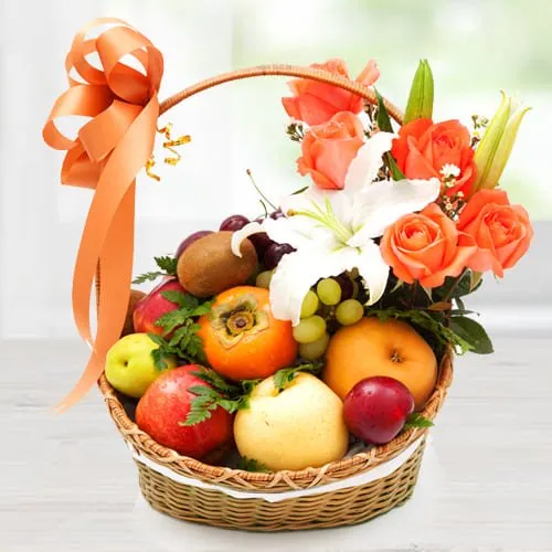 Luscious Imported Fruits Basket with Orange Roses n White Lily