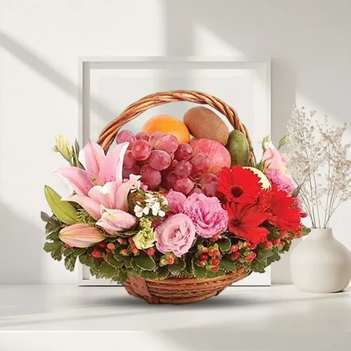 Delightful Fresh Fruits Basket decorated with Lily, Roses n Gerberas