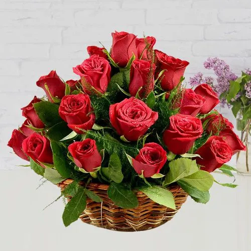 Delightful Array of Red Roses in Round Basket