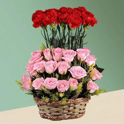 Artful Display of Pink Roses N Red Carnation in Basket