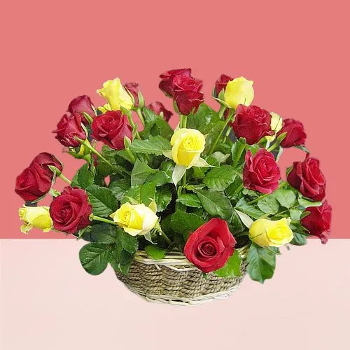Artful Red N Yellow Roses in Round Cane Basket