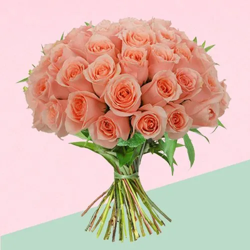 Blushing Bouquet of Peach Roses with Green Leaves