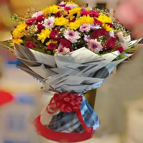 Gorgeous Tissue Wrapped Bouquet of Mixed Colorful Flowers