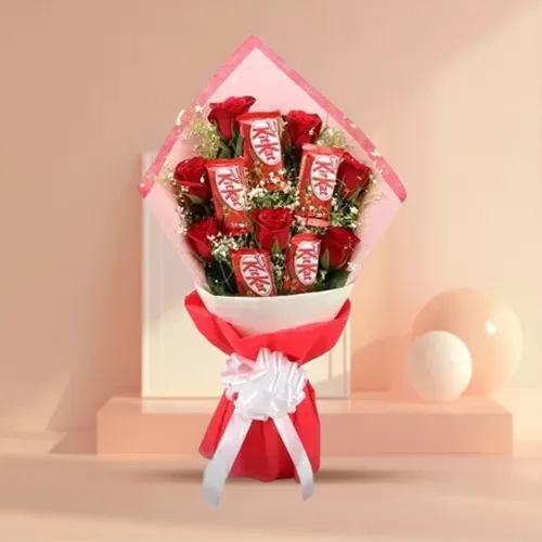 Mesmerizing Red Roses N KitKat Chocolate Tissue Wrapped Bouquet