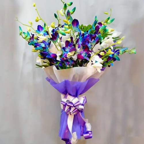 Gorgeous Bouquet of Blue n White Orchids with Tissue Wrapping	