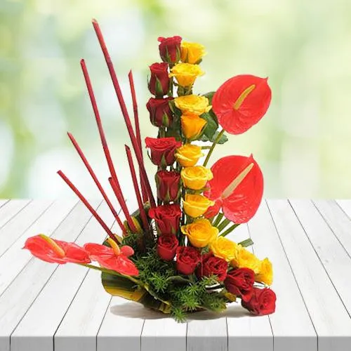 Captivating Red N Yellow Roses N Anthurium Arrangement