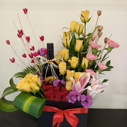 Elegant Box Arrangement of Mixed Flowers with Sparkling Fruit Juice