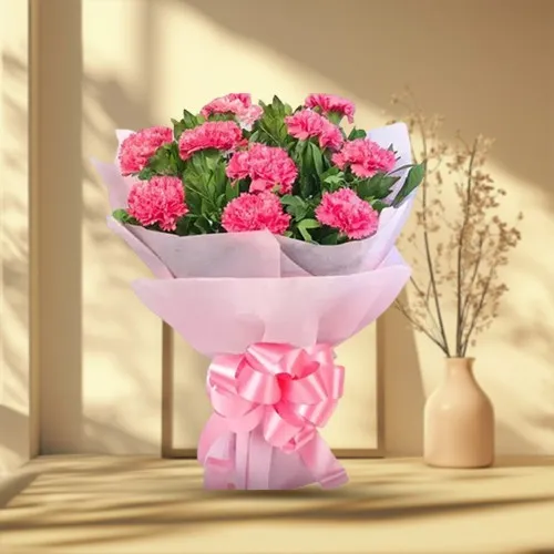 Deliver this petite Hand Bunch of Pink Carnations in Tissue Packing