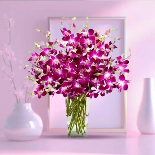 Elegant Collection of Orchids in a Glass Vase