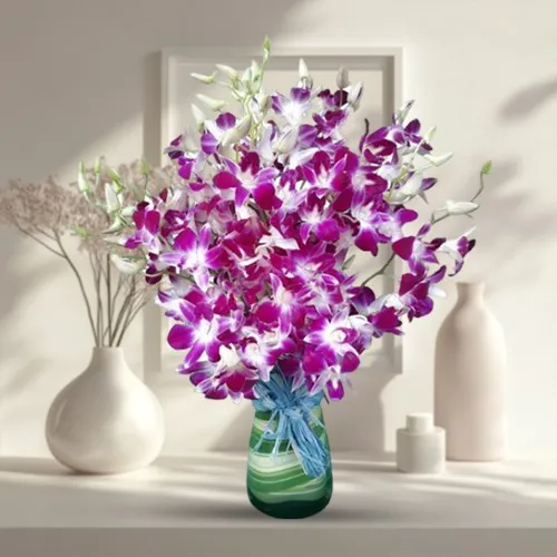 Eye-Catching Arrangement of Orchids in a Glass Vase