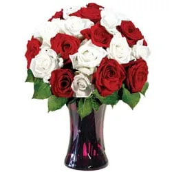 Dazzling White N Red Roses arranged in Glass Vase
