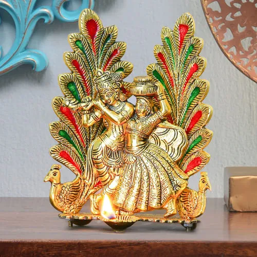 Mesmerizing Peacock Design Radha Krishna Statue with Diya