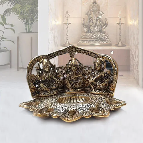 Shop for Metallic Diya with Ganesh, Lakshmi N Saraswati Idol