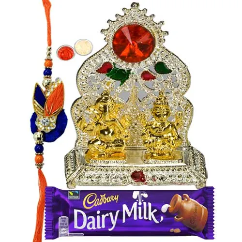Silver Plated Mandap with Golden Ganesh Laxmi Idol and Cadbury Dairy Milk Chocolate with Rakhi and Roli Tilak Chawal