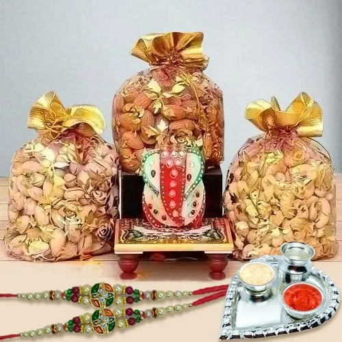 Appealing Stone Rakhis with Dry Fruits, Marble Ganesha n Paan Shaped Thali