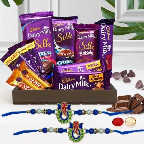 Exclusive Ganesh Metal Rakhi with Cadbury Luxurious Hamper