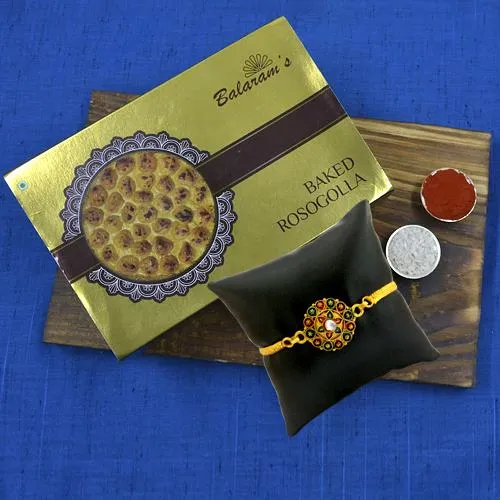 Enjoyable Balaram Mullicks Baked Rasgulla with Golden Plated Rakhi
