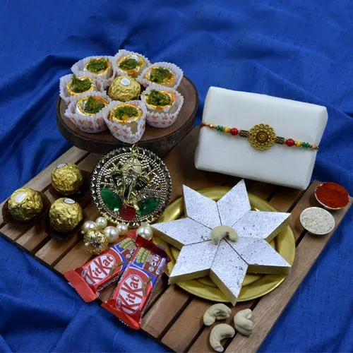 Exquisite Gift of Om Rakhi, Puja Thali, Haldiram Sweets N Chocolates