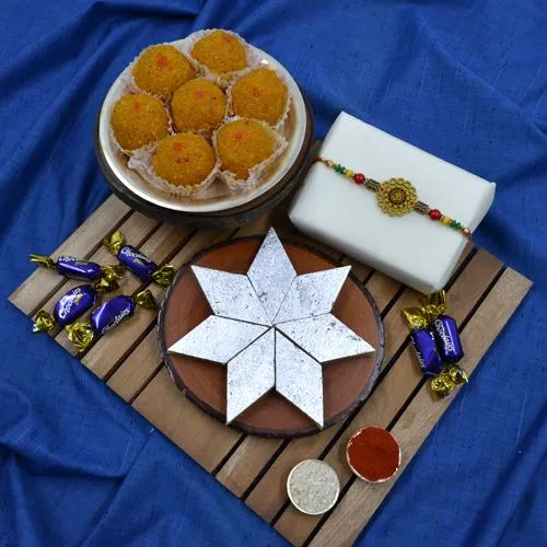 Pious Om Rakhi with Haldiram Mithai, Chocolate N Puja Thali