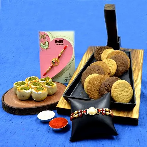 Traditional Haldiram Kaju Pista Basket with Cookie Mans Cookies  N  Twin Rakhi