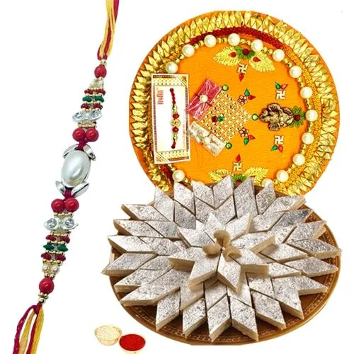 Delicious Kaju Katli and Designer Pooja Thali along Rakhi, Roli, Tilak and Chawal