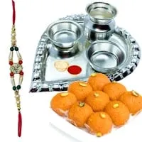 Laddoo from Haldiram and Silver Plated Paan Shaped Puja Aarti Thali along with Rakhi