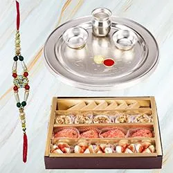 Assorted Sweets from Haldiram and Silver Plated Paan Shaped Puja Aarti Thali along with Rakhi