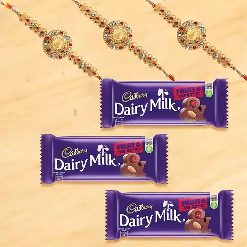 Outstanding Rakhi with Cadbury Fruit n Nut Chocolates Bar Trio