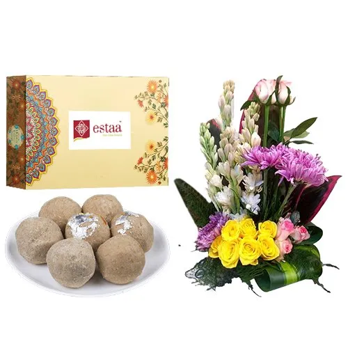 Delectable Sunnundalu from Estaa Sweets with Mixed Flower Arrangement