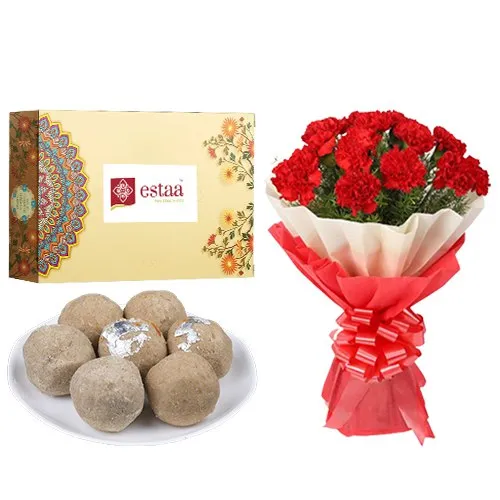 Delightful Sunnundalu from Estaa Sweets with Red Carnation Tissue Wrapped Bouquet