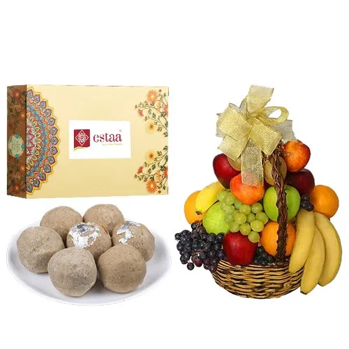 Pleasurable Sunnundalu from Estaa Sweets with Fresh Fruit Basket